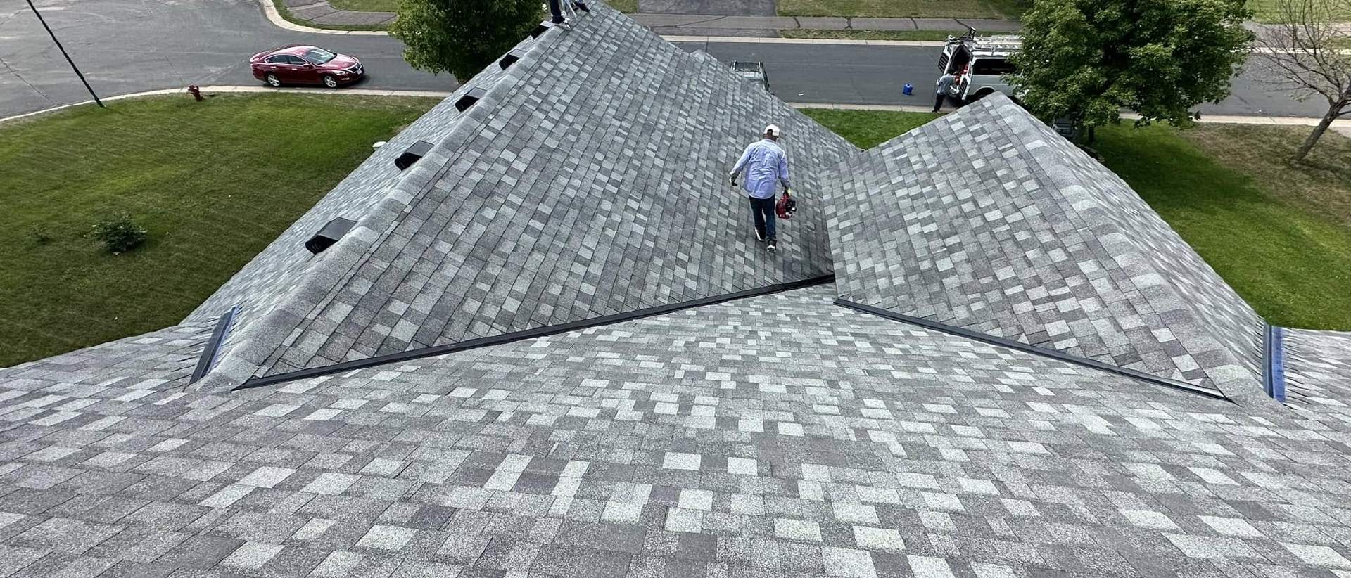 omega exteriors checking out a roof