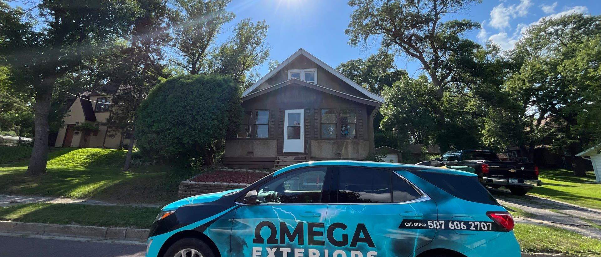 omega exteriors van parked in front of a finished home