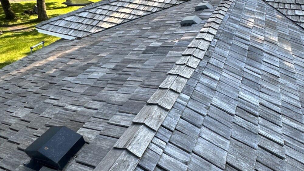 Weathered wood shake shingles on a roof