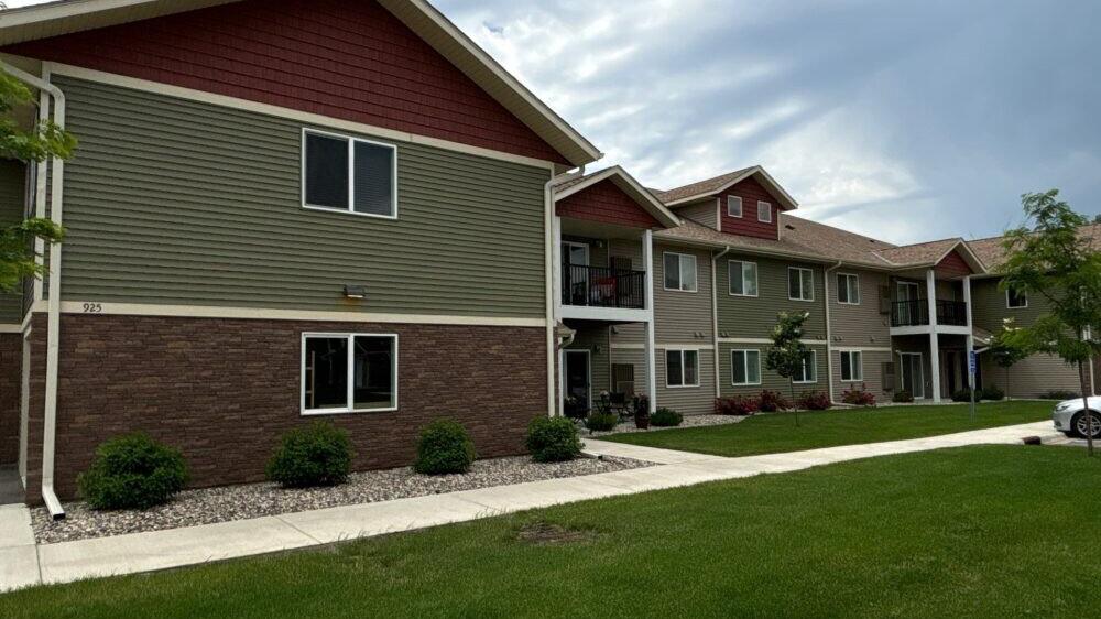 Apartment buildings with new green and red siding