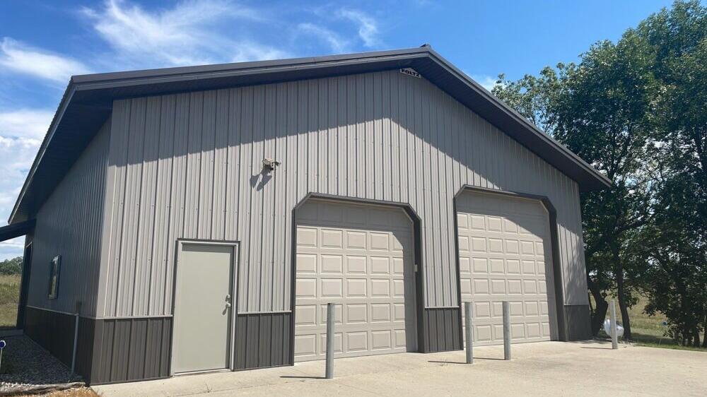Steel siding on a two-door garage building