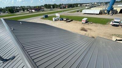 Standing-seam metal roof on a commercial building