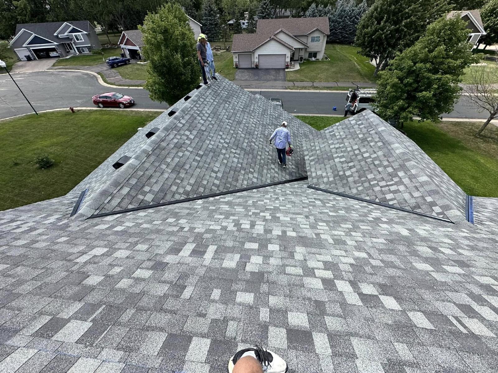 omega exteriors checking out a roof