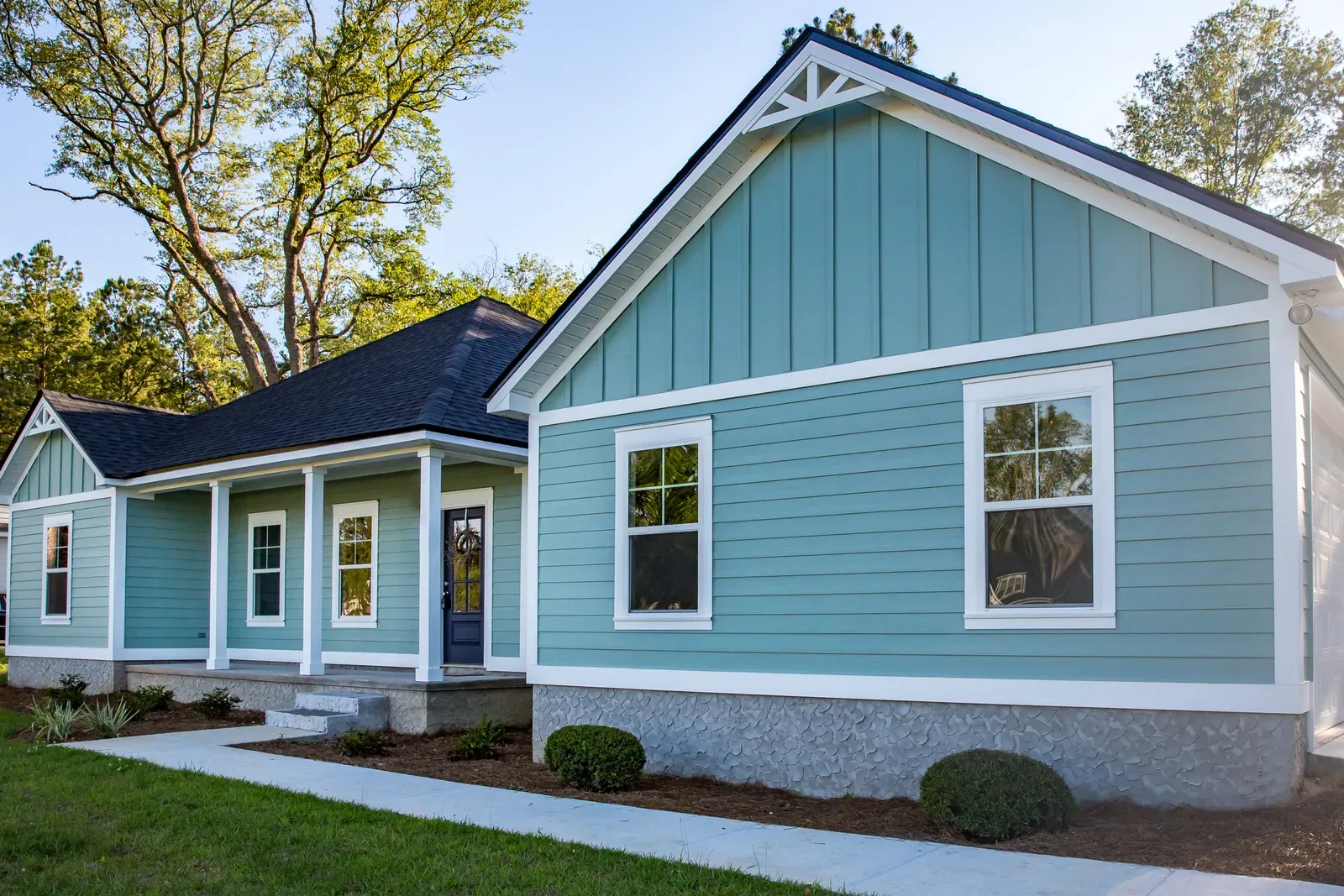 A residential home showcasing newly installed fiber-cement siding. | Omega Exteriors