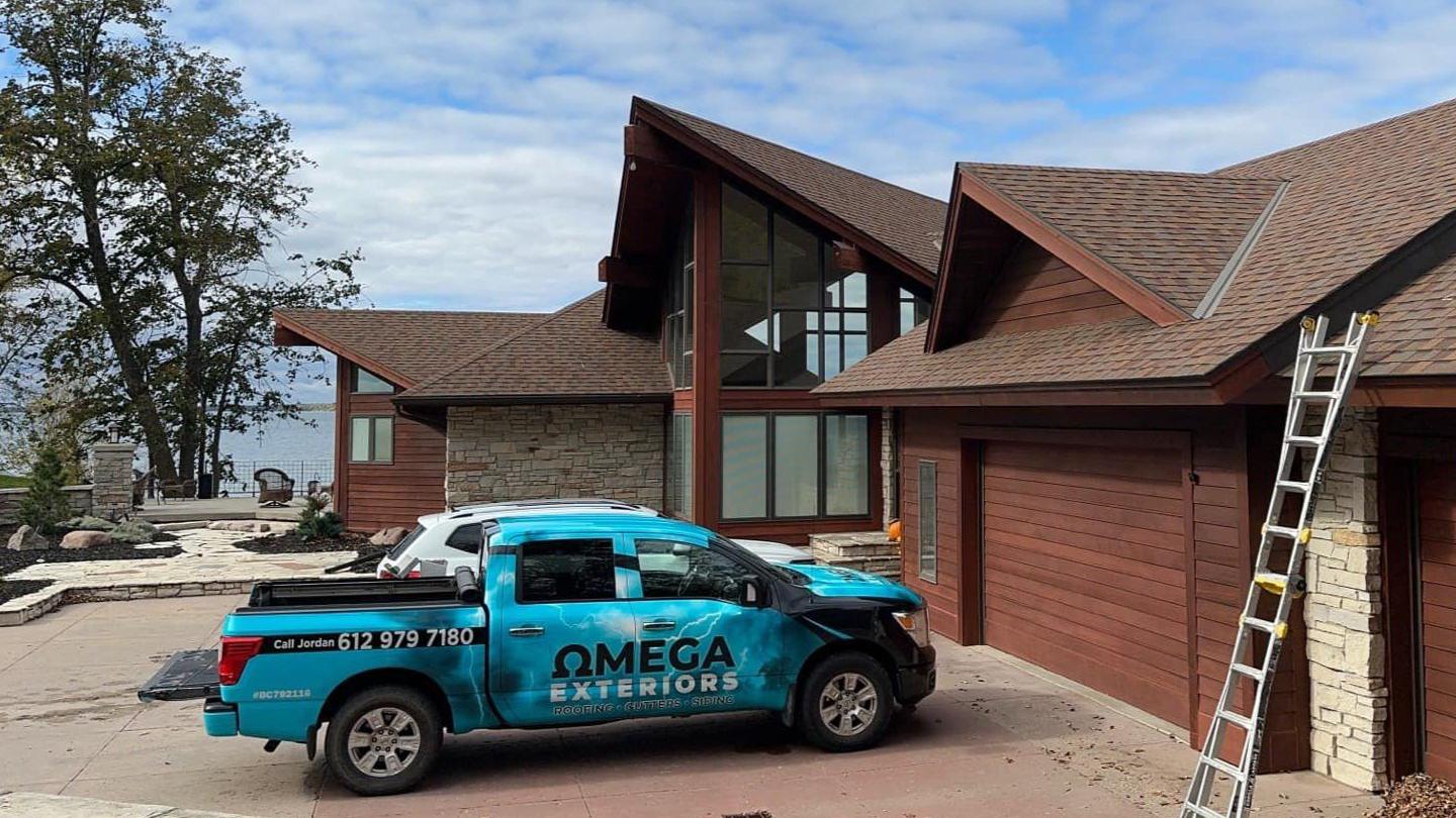 omega exteriors truck parked in a driveway