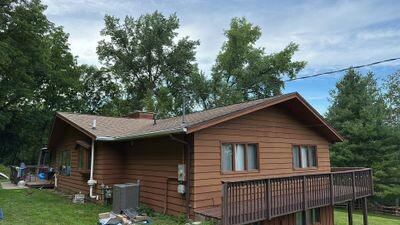 Cedar siding on a home with a wraparound deck