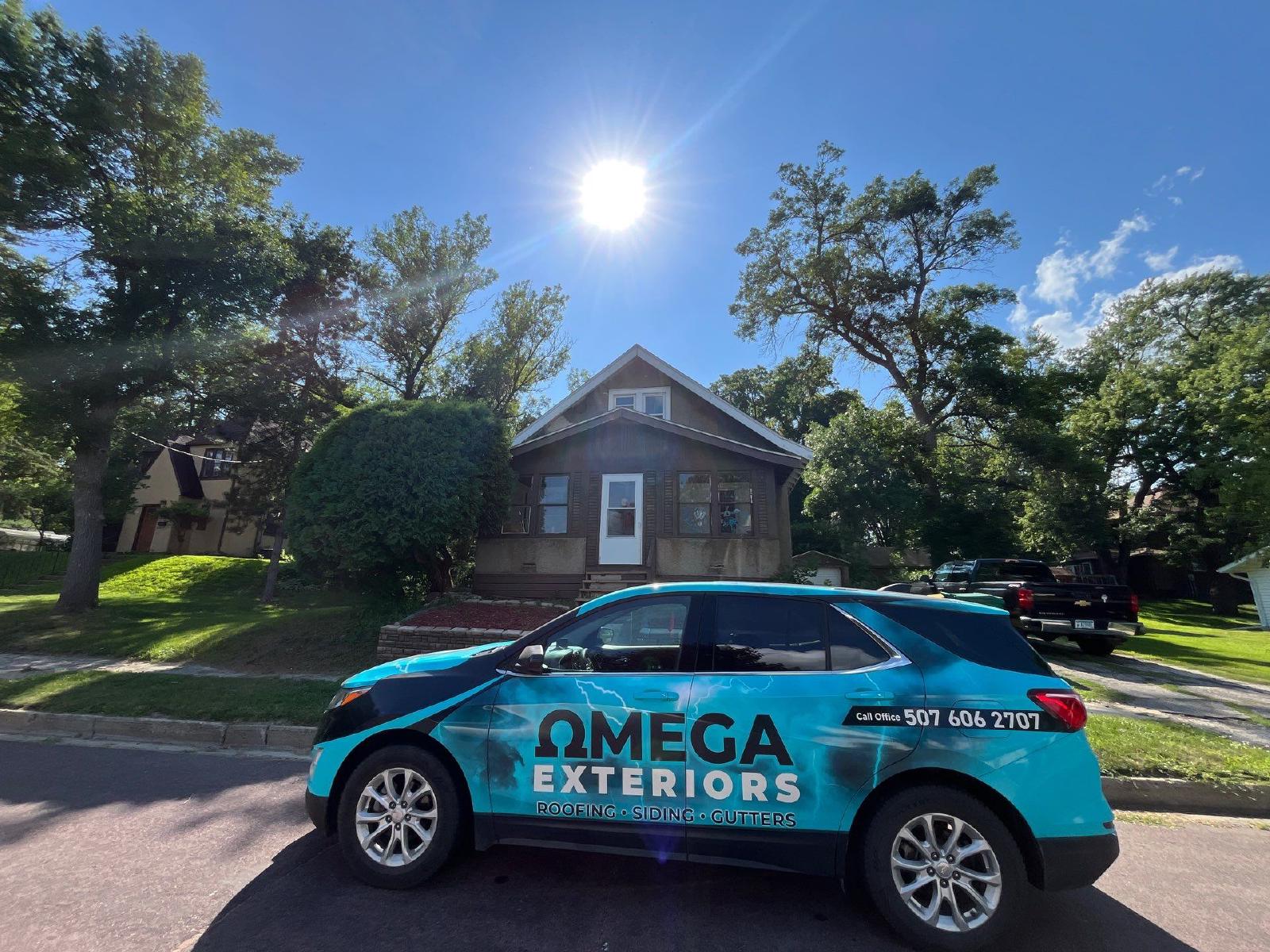 omega exteriors van parked in front of a finished home