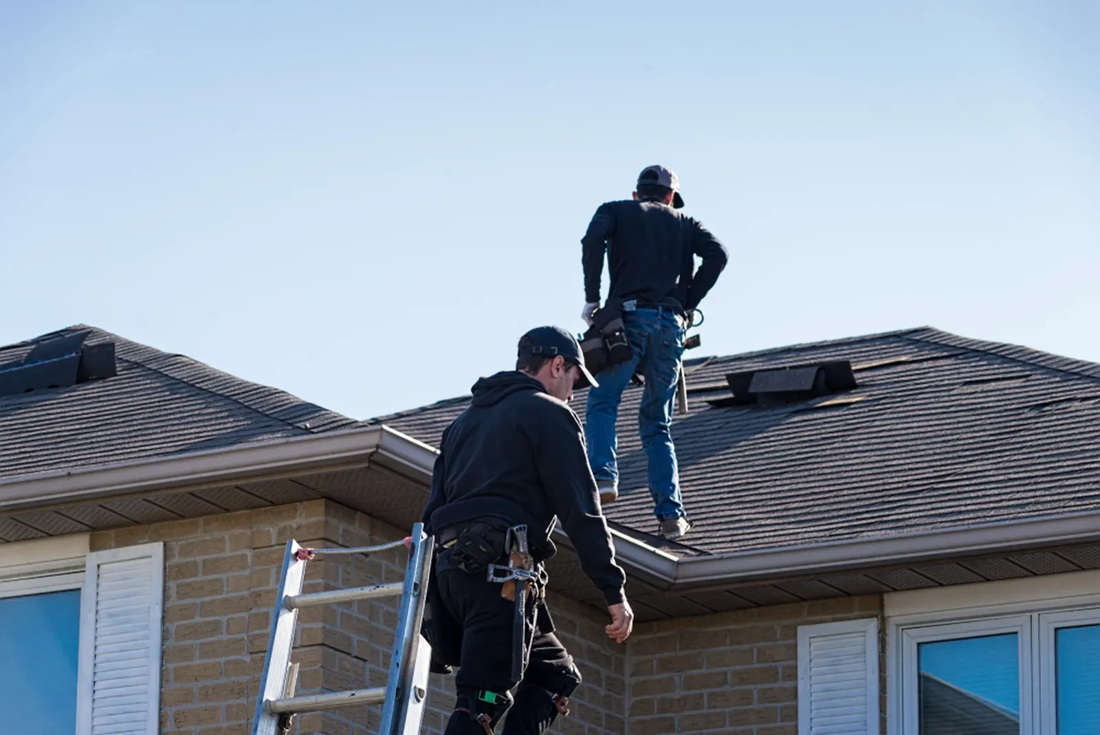 A newly repaired asphalt roof on a residential home, showcasing quality workmanship. | Omega Exteriors