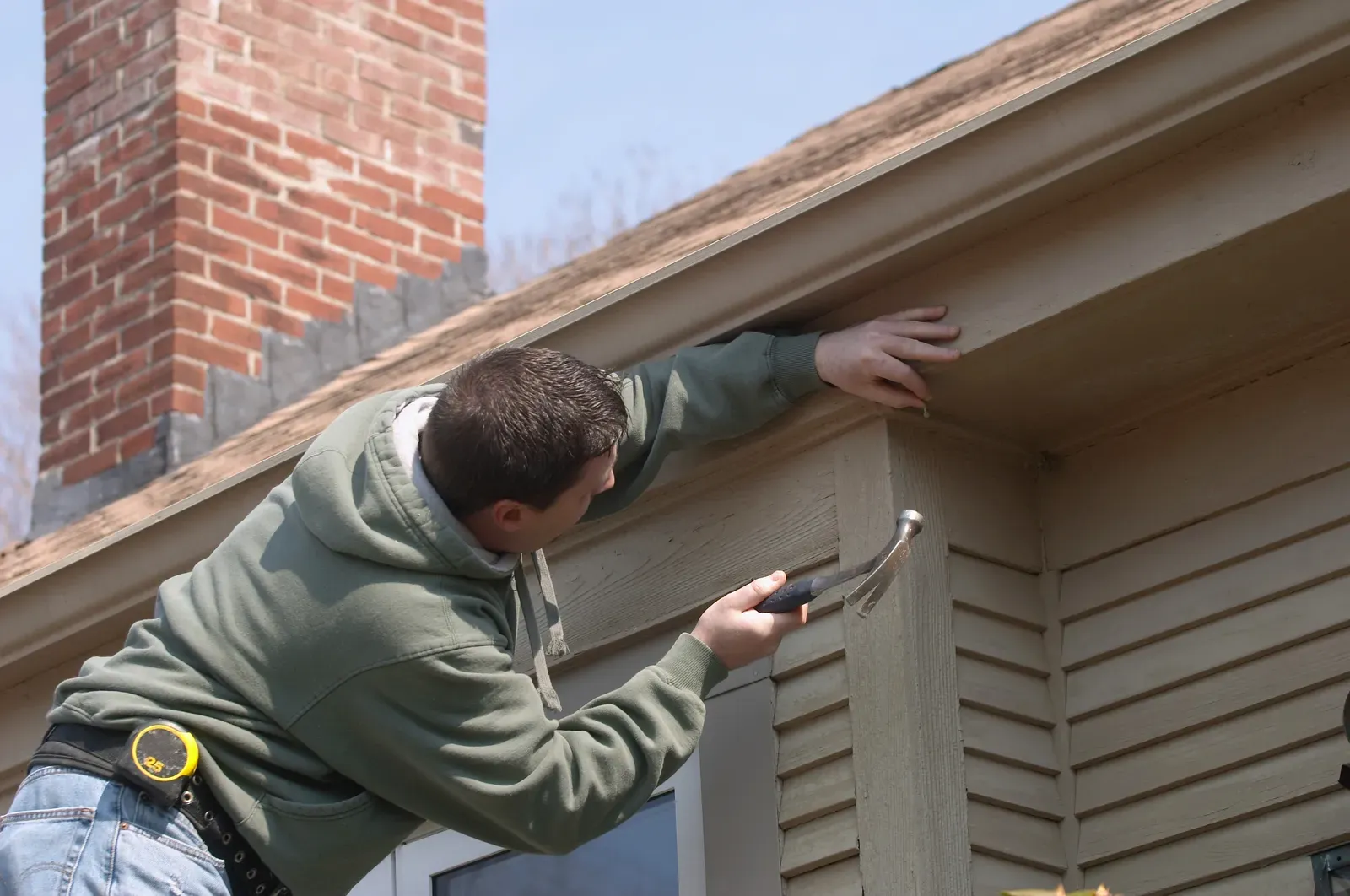 Vinyl siding repair on a residential home, showcasing modern and durable exterior finish. | Omega Exteriors
