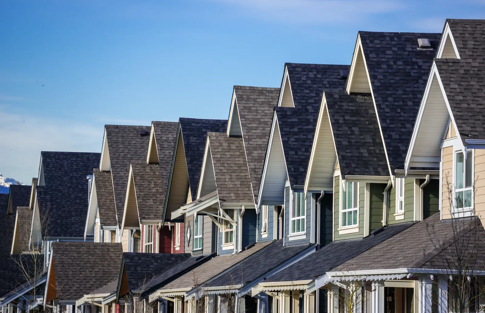 A multi-family building with an asphalt roof being replaced. | Omega Exteriors