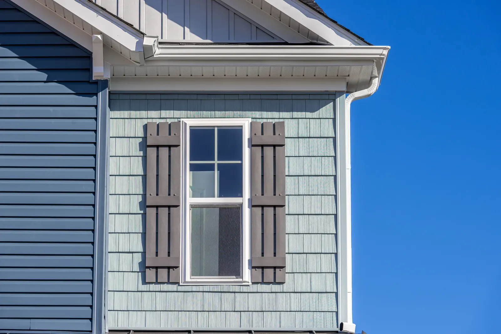 "Residential siding installation and repair with shake design, hero-approved quality." | Omega Exteriors