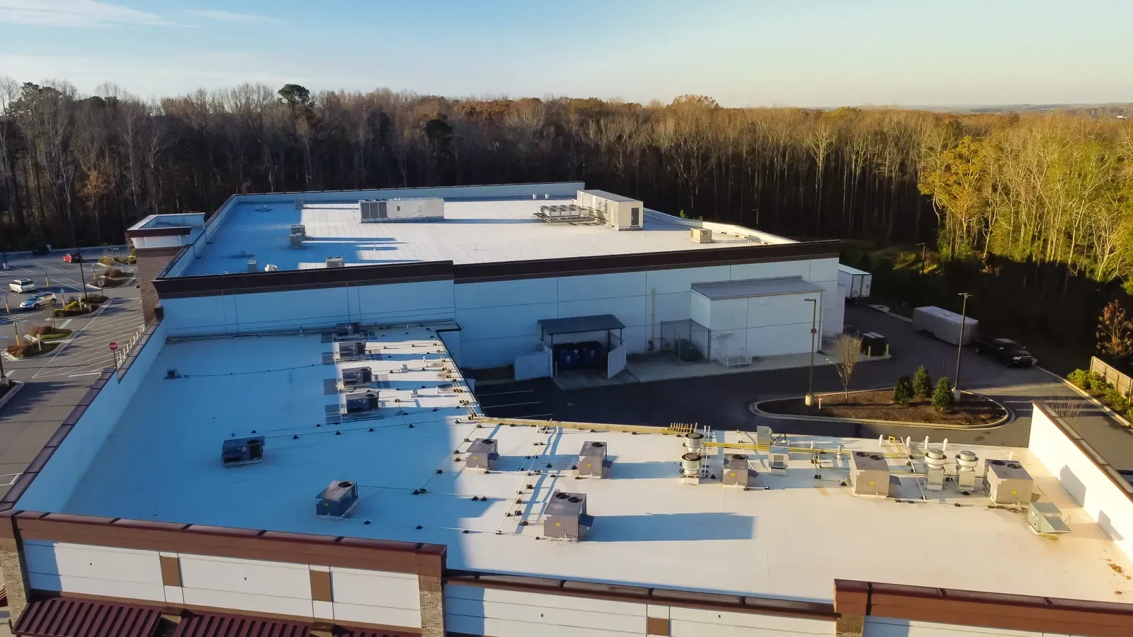 "Commercial roof installation with EPDM, featuring a hero-approved replacement process." | Omega Exteriors