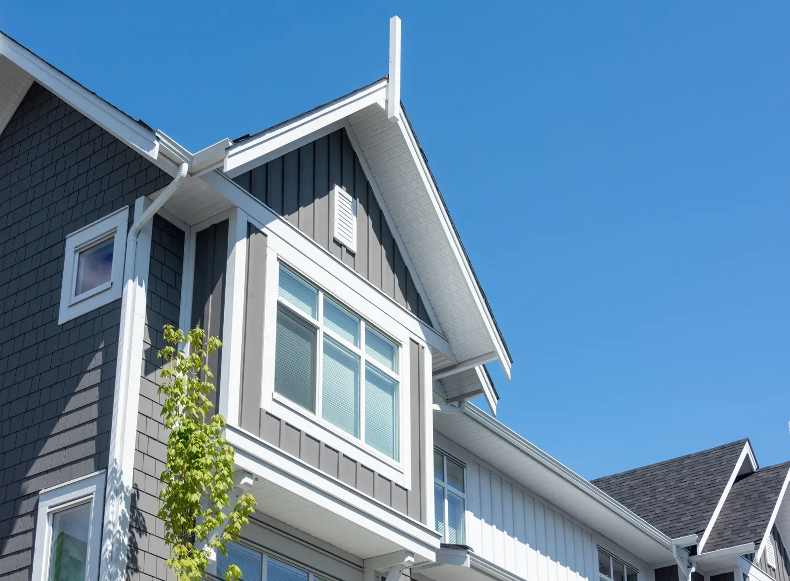 New casement window installation in a residential setting. | Omega Exteriors